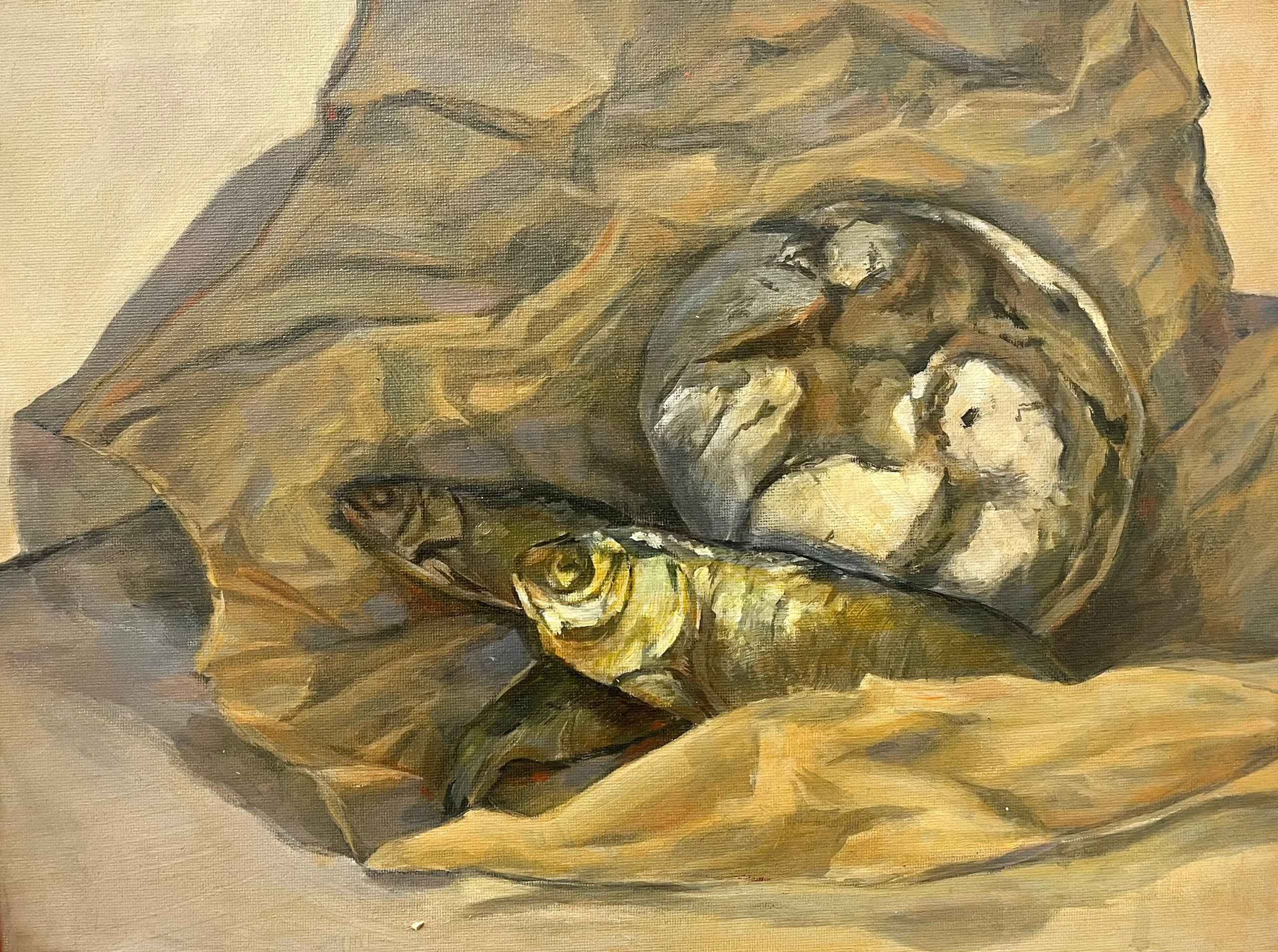 A still life with pastry and dried fish in a crunched paper sheet