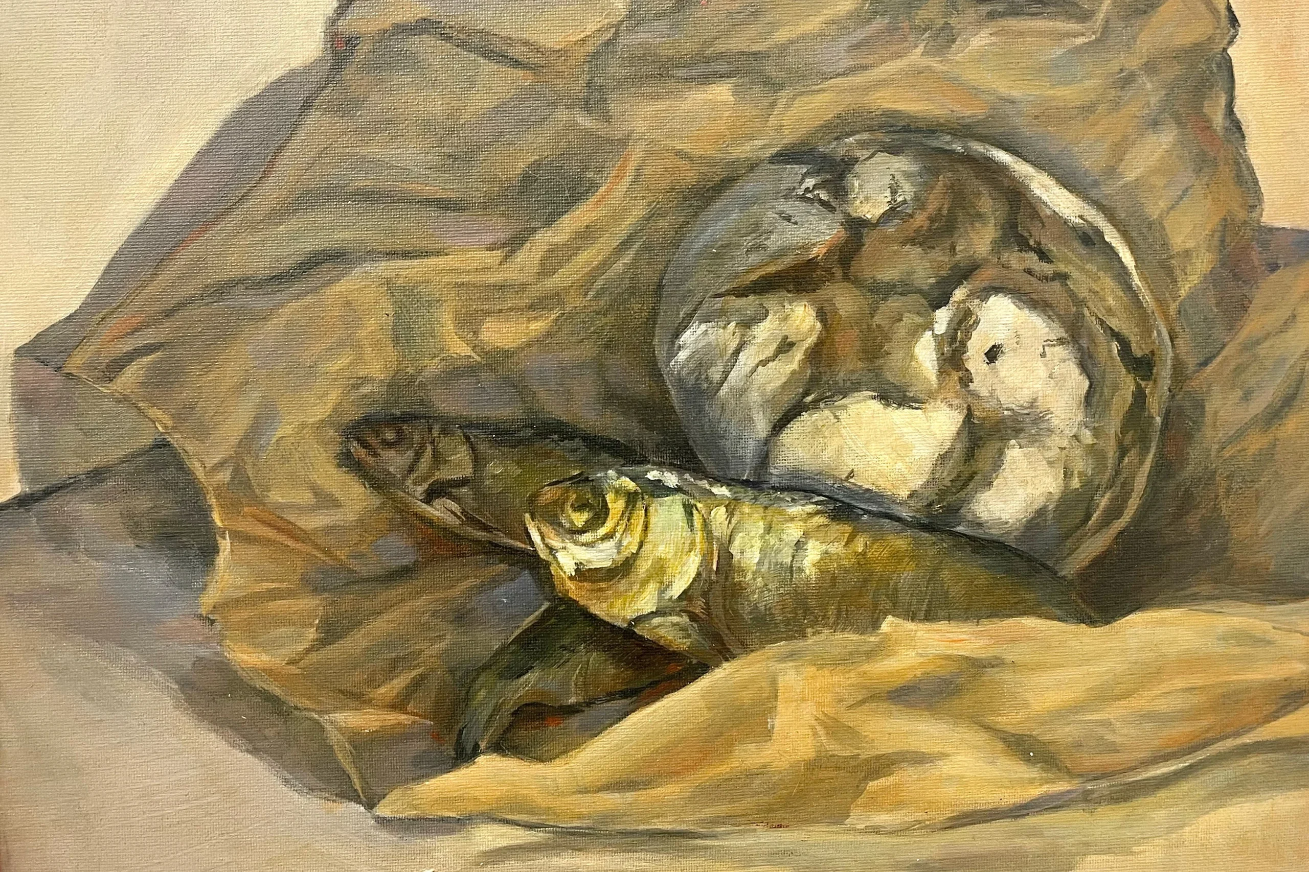 A still life with pastry and dried fish in a crunched paper sheet